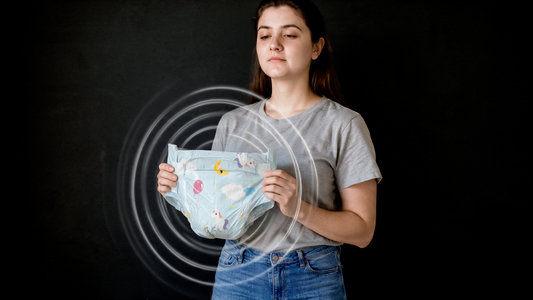 Adult woman holding an unworn diaper with a spiral visual effect